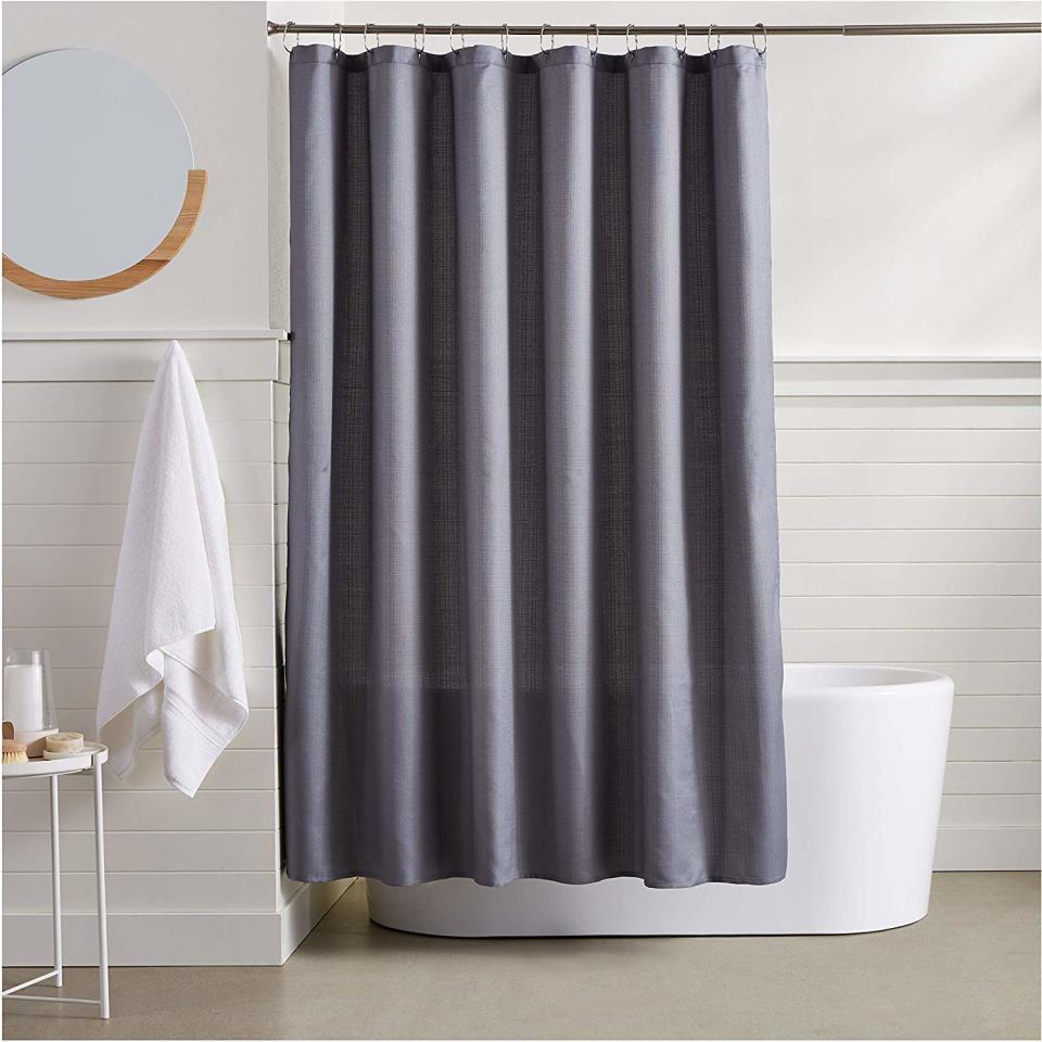 This linen style curtain gives a hotel-like vibe to even the plainest bathroom. (Photo: Amazon)