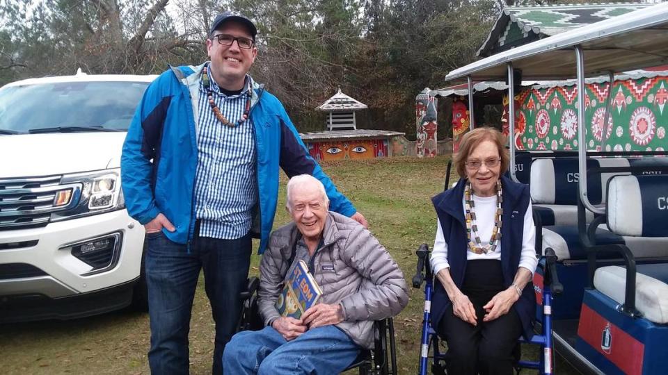 Pasaquan director Michael McFalls took a picture with former President Jimmy Carter and wife Rosalynn during a tour Sunday. Carter and about 40 members of his family toured the art site which honors the work of Eddie Owens Martin, known as St. EOM.