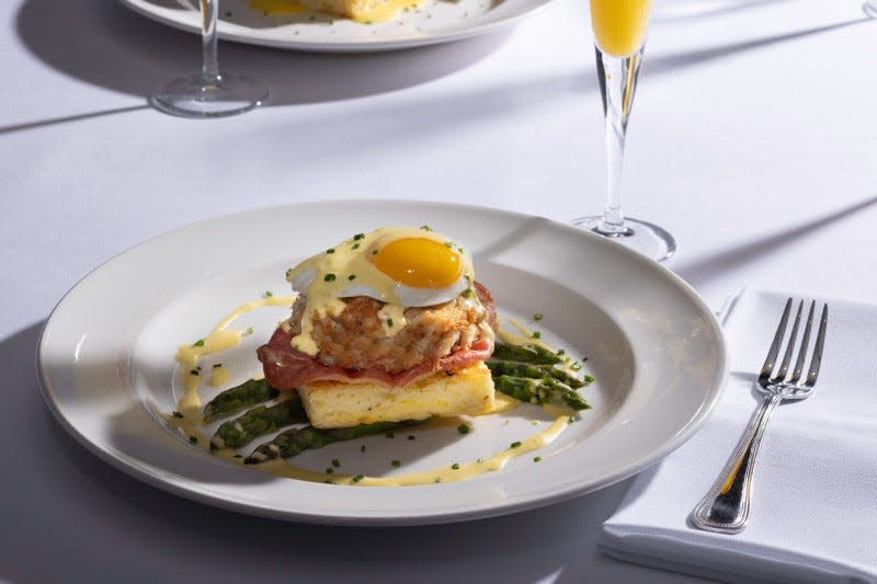 Crab cake benedict with truffle hollandaise, asparagus and white cheddar hash browns from The Capital Grille.