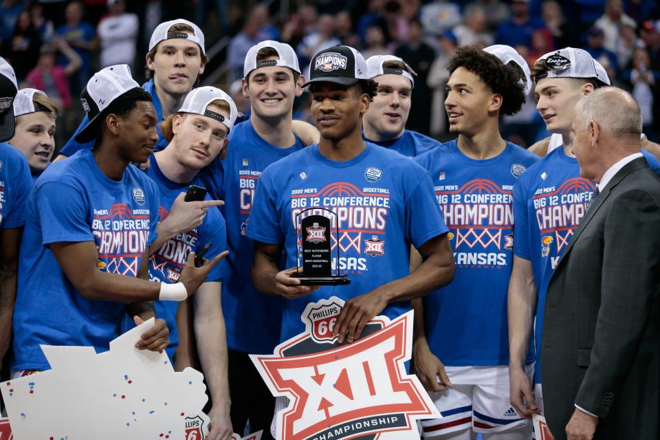 Kansas guard Ochai Agbaji is presented the most outstanding player award after Jayhawks beat Texas Tech in the Big 12 tournament final.