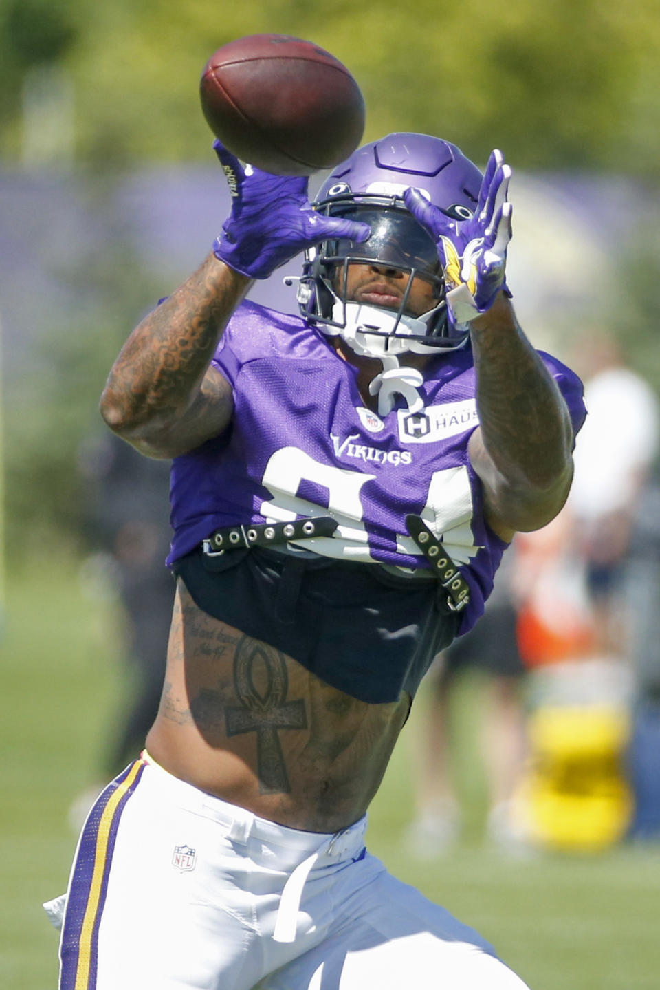 Minnesota Vikings tight end Irv Smith Jr. receives a pass in drills during a joint NFL football training camp with the Denver Broncos Thursday, Aug. 12, 2021, in Eagan, Minn. (AP Photo/Bruce Kluckhohn)