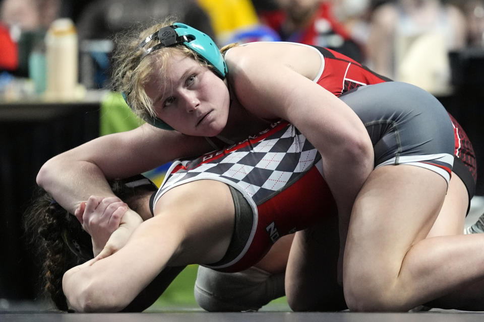 Easton's Aubre Krazer, top, tries to flip Hazleton Area's Miah Molinaro, bottom, during the first found of the PIAA High School Wrestling Championships in Hershey, Pa., Thursday, March 7, 2024. Girls’ wrestling has become the fastest-growing high school sport in the country. (AP Photo/Matt Rourke)