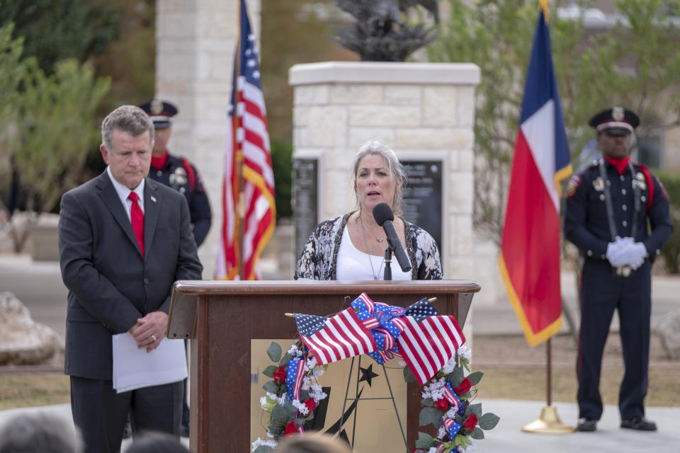 Teena Nemelka, mother of fallen soldier, PFC Aaron Nemelka in the 2009 terrorist attack on Fort Hood delivers an emotional reading at the ten year anniversary of the November 5, 2009 Memorial in Killeen, Texas on Tuesday, Nov. 5, 2019. ( Jeromiah Lizama/The Killeen Daily Herald via AP)