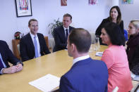 Facebook CEO Mark Zuckerberg, background left, sits during a meeting with European Commissioner for Values and Transparency Vera Jourova, front second right, at EU headquarters in Brussels, Monday, Feb. 17, 2020. (AP Photo/Francisco Seco)