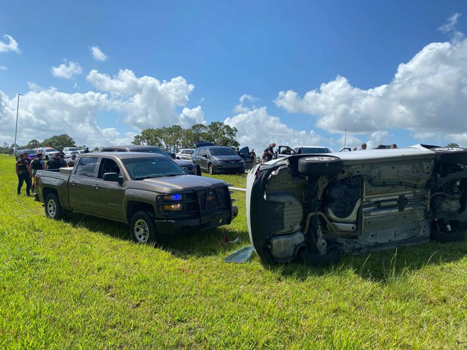 A vehicle lays on its side after a Martin County sheriff's detective performed a pit maneuver and deputies deployed CS gas to force a group of people out of a vehicle after a pursuit on I95.