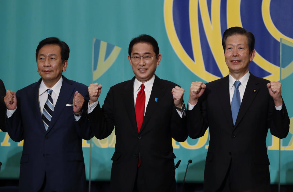 Leaders of Japan's main political parties, the Constitutional Democratic Party of Japan leader Yukio Edano, left, Prime Minister and ruling Liberal Democratic Party President Fumio Kishida, center, Komeito party leader Natsuo Yamaguchi attend a debate session ahead of Oct. 31, 2021 lower house election, at the Japan National Press Club in Tokyo Monday, Oct. 18 , 2021. (Issei Kato/Pool Photo via AP)