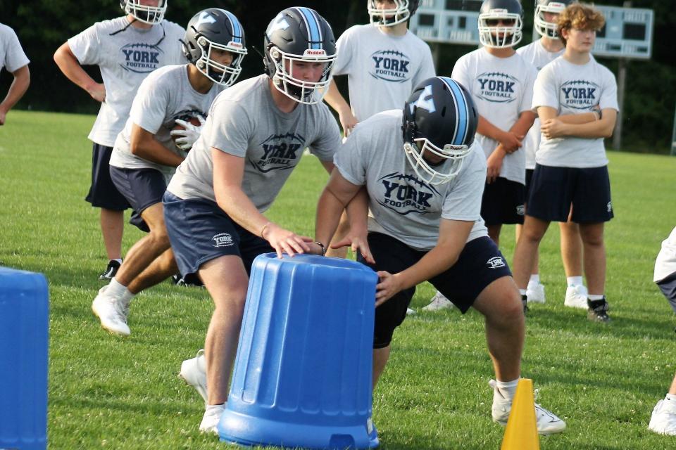 The York High School football team gets back to work Monday, Aug. 14, 2023, the first practice of the new season.
