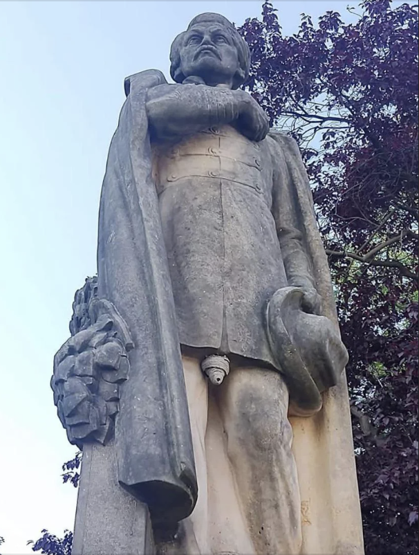 A wasp nest on a statue