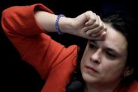 Jurist Janaina Paschoal (C), co-author of the complaint that originated the impeachment process against suspended president Dilma Rousseff, gestures during the final session of debate and voting on Rousseff's impeachment trial in Brasilia, Brazil August 26, 2016. REUTERS/Ueslei Marcelino