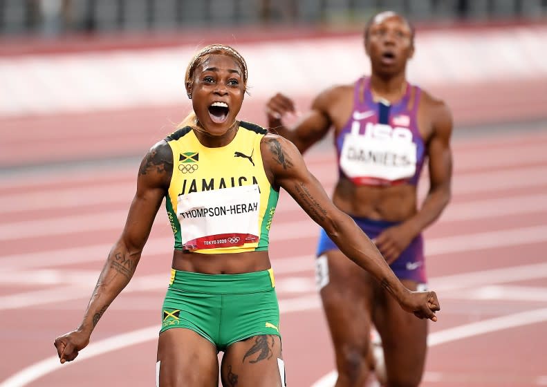 -TOKYO,JAPAN July 31, 2021: Jamaica's Elaine Thompson-Herah celebrates the gold medal in the 100m final at the 2020 Tokyo Olympics. (Wally Skalij /Los Angeles Times)