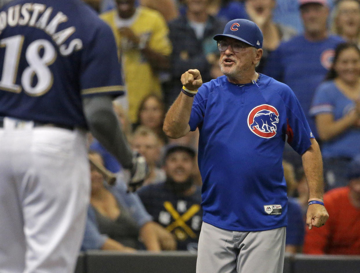 Chicago Cubs' Joe Maddon, right, points to an umpire after being ejected from the game during the eighth inning of a baseball game against the Milwaukee Brewers Monday, Sept. 3, 2018, in Milwaukee. (AP Photo/Aaron Gash)