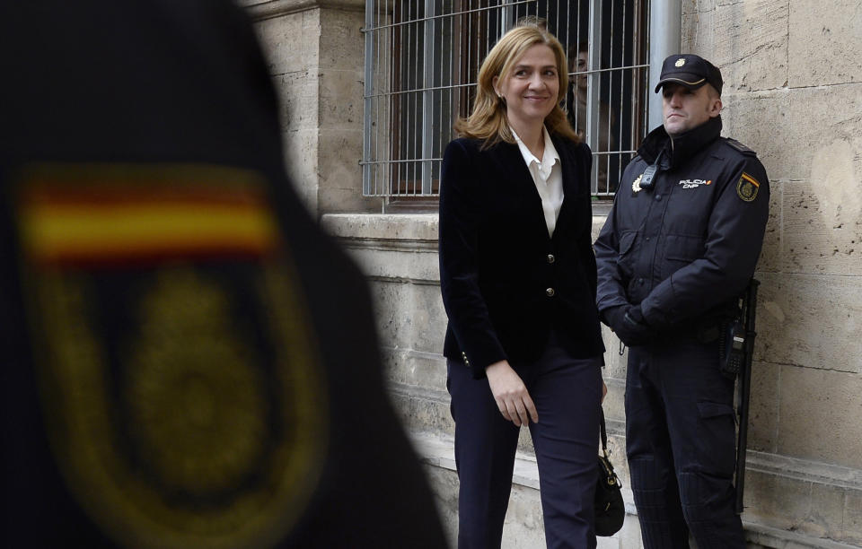 FILE - In this Feb. 8, 2014 file photo, Spain's Princess Cristina arrives at the courthouse in Palma de Mallorca, Spain. A Spanish court on Friday Feb. 17, 2017, found Princess Cristina not guilty in a tax fraud case in which her husband Inaki Urdangarin , was sentenced Friday to 6 years and 3 months in prison for evading taxes, fraud and various other charges. (AP Photo/Manu Fernandez, File)
