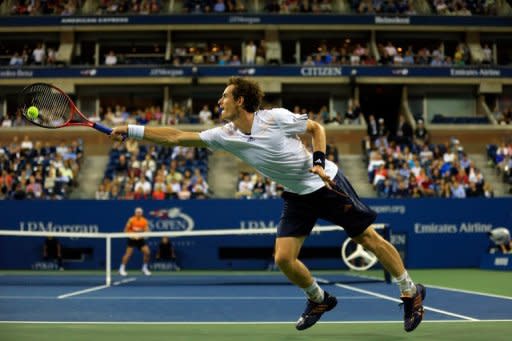 Andy Murray of Great Britain returns a shot to Milos Raonic of Canada during Day Eight of the 2012 US Open September 3, 2012 in New York City. Murray defeated Raonic 6-4, 6-4, 6-2