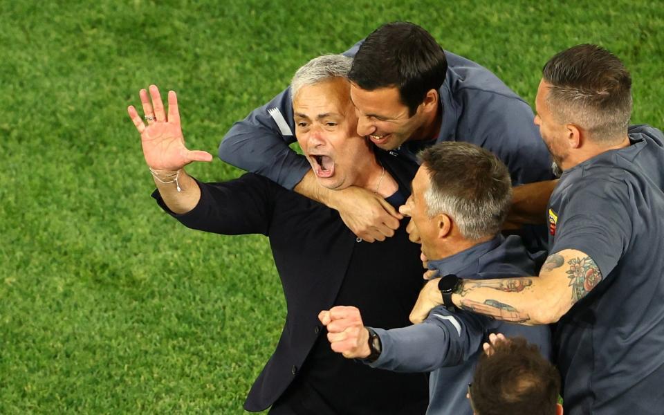 AS Roma coach Jose Mourinho celebrates with his coaching staff after winning the Europa Conference League - REUTERS