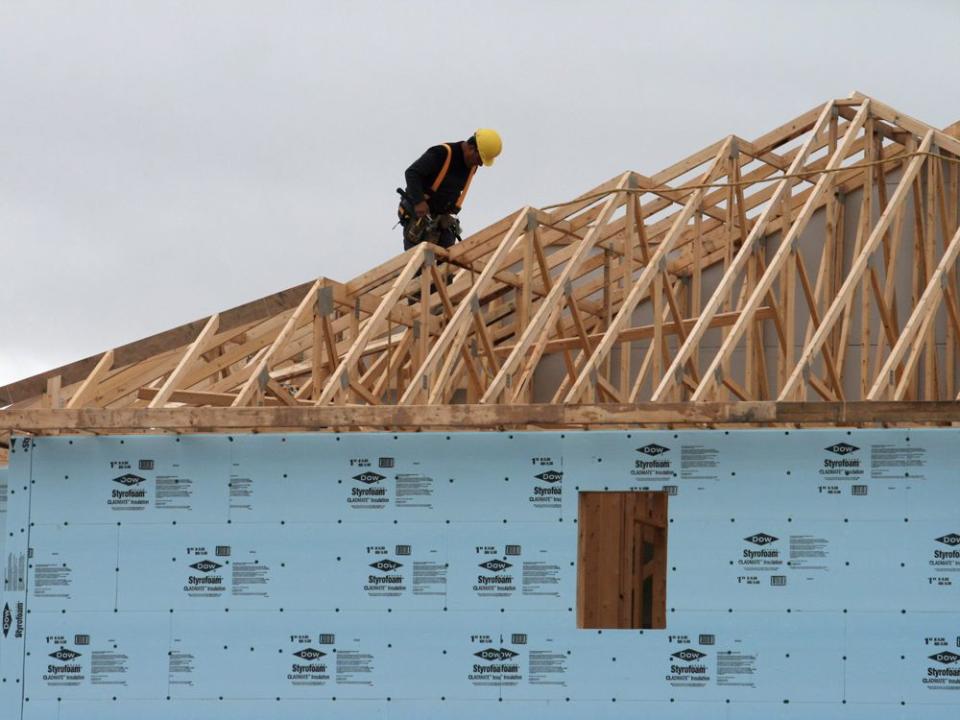  A construction worker works on a house in a new housing development in Oakville, Ont.