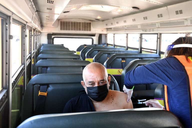 March 1, 2021: Rene Urey, a Los Angeles school district special education assistant gets the COVID-19 vaccine aboard a school bus. (Getty Images)