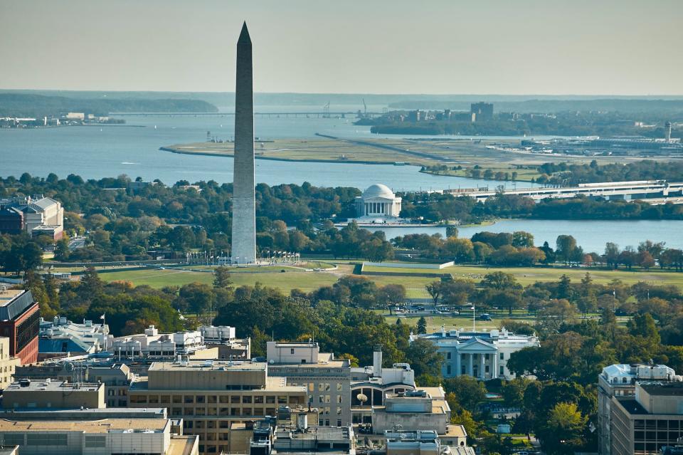 Aerial photograph of Washington, DC, showing The White House, Washington Monument, Jefferson Memorial, Potomac River and National Airport.