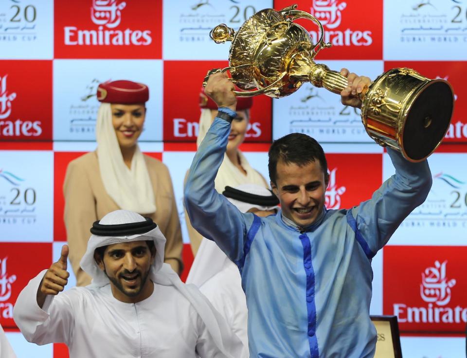 Jockey William Buick, celebrates with Sheikh Hamdan bin Mohammed Al Maktoum.