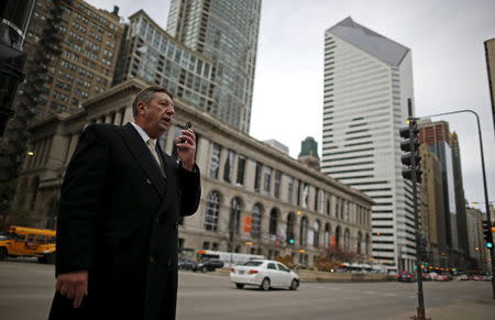 U.S. Republican presidential candidate Michael Petyo leaves a voice message while campaigning in downtown Chicago, Illinois, November 20, 2015. REUTERS/Jim Young