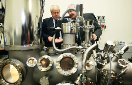 Britain's Foreign Secretary Boris Johnson looks at a scanning tunneling microscope at Trinity College, Dublin, Ireland November 17, 2017. REUTERS/Brian Lawless/Pool