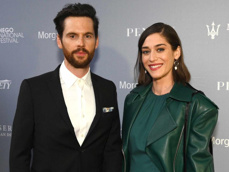 <p>Andrew Toth/Getty</p> Tom Riley and Lizzy Caplan in 2019.