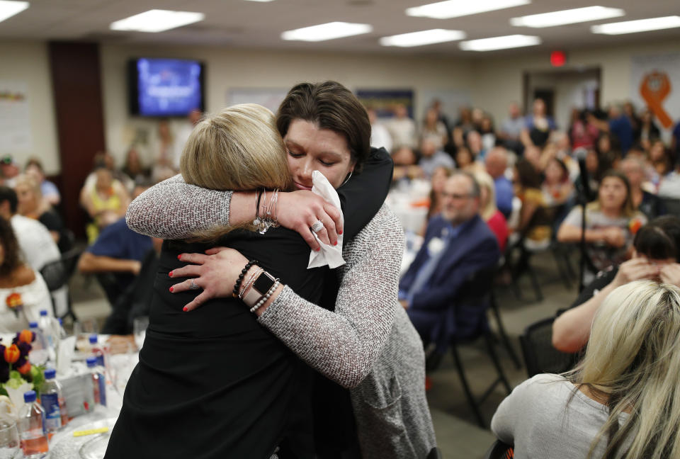 Amanda Peterson, right, embraces nurse Marlena Ryan during a reunion event for victims of the Oct. 1 shooting and their health care providers at Sunrise Hospital, Friday, Sept. 14, 2018, in Las Vegas. Ryan helped take care of Peterson after she was injured in the mass shooting. (AP Photo/John Locher)