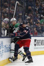 Dallas Stars' Joe Pavelski, left, and Columbus Blue Jackets' Vladislav Gavrikov fight for the puck during the first period of an NHL hockey game Monday, Oct. 25, 2021, in Columbus, Ohio. (AP Photo/Jay LaPrete)