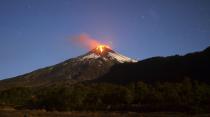 Ash and lava spew from the Villarrica volcano, as seen from Pucon town in the south of Santiago, March 3, 2015. Volcano Villarrica in southern Chile erupted in the early hours of Tuesday, sending a plume of ash and lava high into the sky, and forcing the evacuation of nearby communities. (REUTERS/Lautaro Salinas)