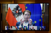 FILE - In this March 17, 2021, file photo, Austria's Chancellor Sebastian Kurz speaks to European Council President Charles Michel via a video conference meeting at the European Council building in Brussels. Leaders fight over everything from virus passports to push tourism to the conditions for receiving pandemic aid relief. Kurz decried how vaccine-buying in the bloc had become a “bazaar,” alleging poorer countries struck out while the rich thrived. (John Thys, Pool via AP, File)