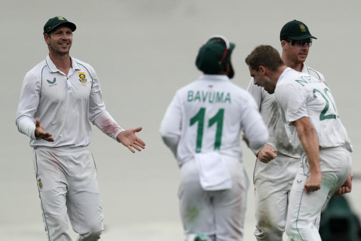 South Africa's Anrich Nortje, second right, celebrates taking the wicket of Australia's Marnus Labuschagne during the first day of their cricket test match at the Sydney Cricket Ground in Sydney, Wednesday, Jan. 4, 2023. (AP Photo/Rick Rycroft)
