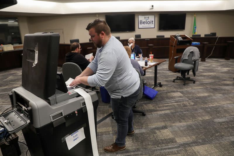 Absentee ballots are counted during the presidential primary election in Wisconsin