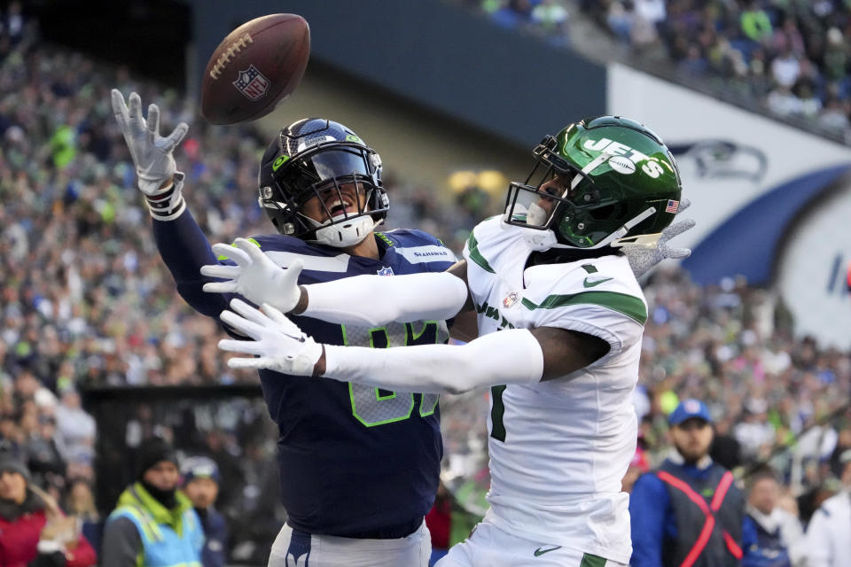 Seattle Seahawks tight end Noah Fant can't make the catch as New York Jets cornerback Sauce Gardner, right, defends during the second half of an NFL football game, Sunday, Jan. 1, 2023, in Seattle. (AP Photo/Ted S. Warren)