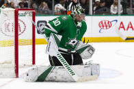 Dallas Stars goaltender Ben Bishop (30) stops a shot attempt during the second period of an NHL hockey game against the Calgary Flames, Sunday, Dec. 22, 2019, in Dallas. (AP Photo/Sam Hodde)