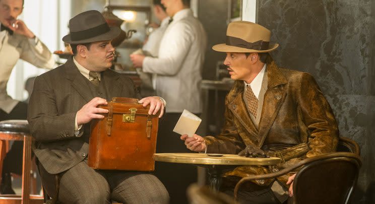 Hector MacQueen (Josh Gad) and Ratchett (Johnny Depp) in 'Murder on the Orient Express' (20th Century Fox)