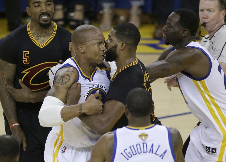 <p>Cleveland Cavaliers center Tristan Thompson, center right, confronts Golden State Warriors forward David West during the first half of Game 5 of basketball’s NBA Finals in Oakland, Calif., Monday, June 12, 2017. (AP Photo/Ben Margot) </p>