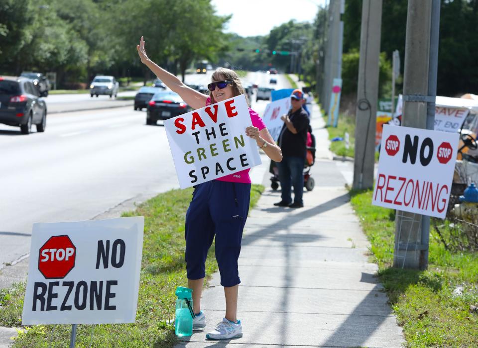 Protesters make their voices heard against the rezoning of the old West End Golf Course.