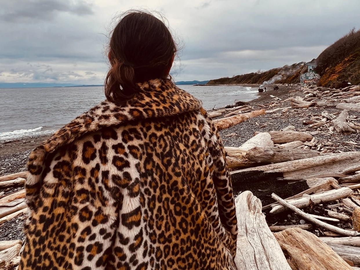 simone wearing a leopard print coast on the beach in victoria canada