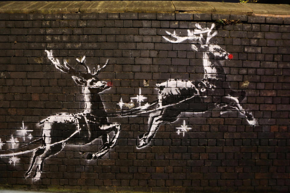 A Banksy reindeer mural in Birmingham has been defaced with red noses (Picture: SWNS)