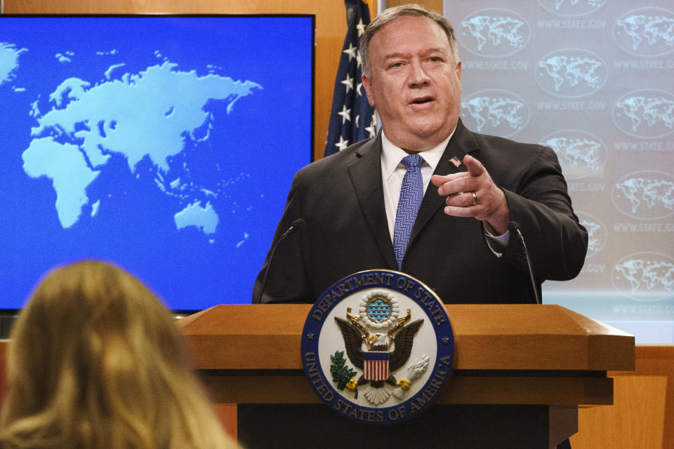 FILE - In this Nov. 10, 2020, file photo, Secretary of State Mike Pompeo gestures toward a reporter while speaking at the State Department in Washington. Pompeo plans to deliver a speech extolling the Trump administration's foreign policy this week in Georgia ahead of key Senate run-off elections that will determine control of the upper chamber of Congress. The accusation of genocide by U.S. Secretary of State Mike Pompeo against China touches on a hot-button human rights issue between China and the West. (AP Photo/Jacquelyn Martin, Pool, File)