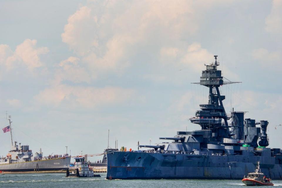 The Battleship Texas passes Seawolf Park and the U.S.S. Stewart, an Edsall-class destroyer escort, as it enters the Galveston Channel toward a dry dock for major repairs Wednesday, Aug. 31, 2022 in Galveston.