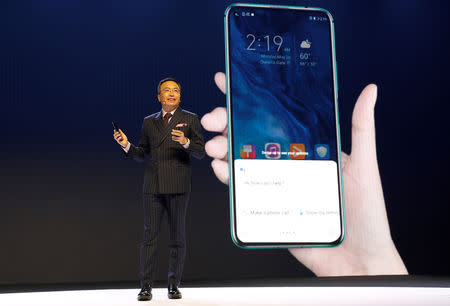 FILE PHOTO: President of Huawei's Honor brand, George Zhao, launches the Honor 20 range of smartphones at an event in London, Britain, May 21, 2019. REUTERS/Peter Nicholls/File Photo