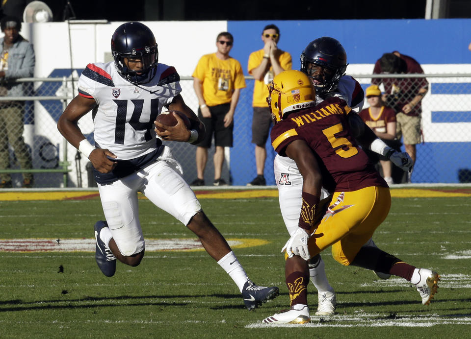 Arizona quarterback Khalil Tate (L) has 1,353 yards and 12 scores on the ground. (AP Photo/Rick Scuteri)