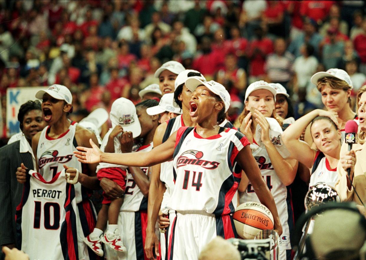Cynthia Cooper and the Houston Comets celebrate after winning the 1999 WNBA championship over the New York Liberty.