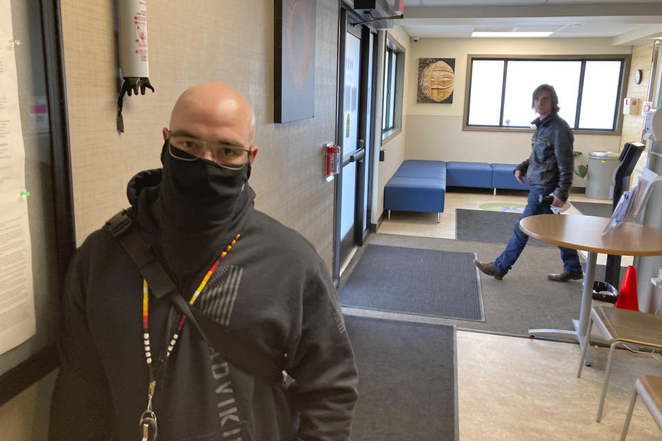 Nick Mull, a peer specialist at Great Circle poses for a photo during an interview at the treatment center in Salem, Ore., on Feb. 24, 2022. Mull helps those recovering from addiction by describing his own life experiences and recovery. Mull was addicted to heroin and used other drugs from an early age but got clean six years ago. Jennifer Worth, Great Circle's operations director, said Mull serves as an example and source of hope to people who come to the facility. (AP Photo/Andrew Selsky)