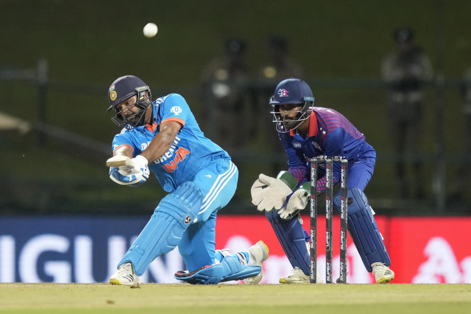 India's Rohit Sharma plays a shot as Nepal's wicketkeeper Aasif Sheikh watches during the Asia Cup cricket match between India and Nepal in Pallekele, Sri Lanka on Monday, Sep. 4. (AP Photo/Eranga Jayawardena)