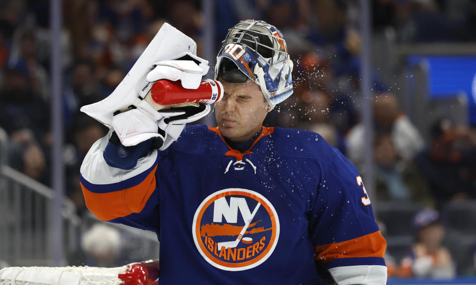 New York Islanders goaltender Ilya Sorokin cools off during a break in the action against the Buffalo Sabres, Saturday, Oct. 14, 2023, in New York. (AP Photo/Noah K. Murray)