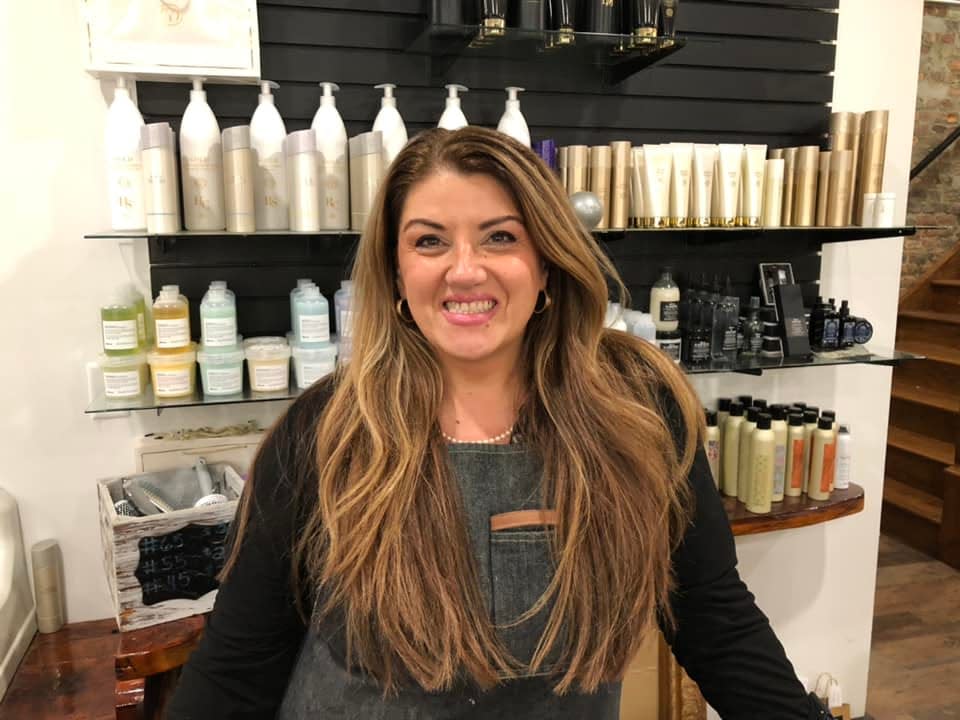 Susan Steward strikes a pose in her hair salon at The Apothic Company in Petersburg on Friday, Sept. 1.