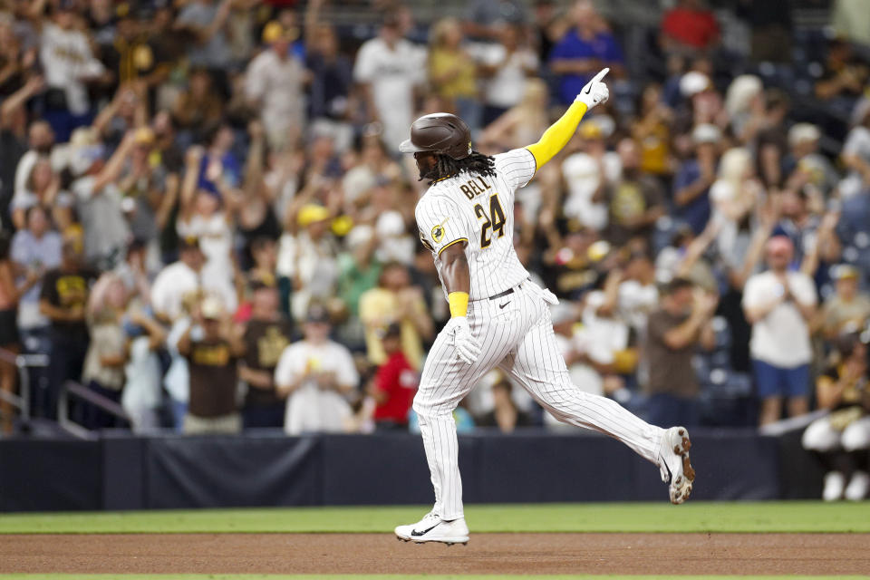 San Diego Padres' Josh Bell gestures while running the bases on a solo home run during the seventh inning against the Arizona Diamondbacks in a baseball game Tuesday, Sept. 6, 2022, in San Diego. (AP Photo/Brandon Sloter)