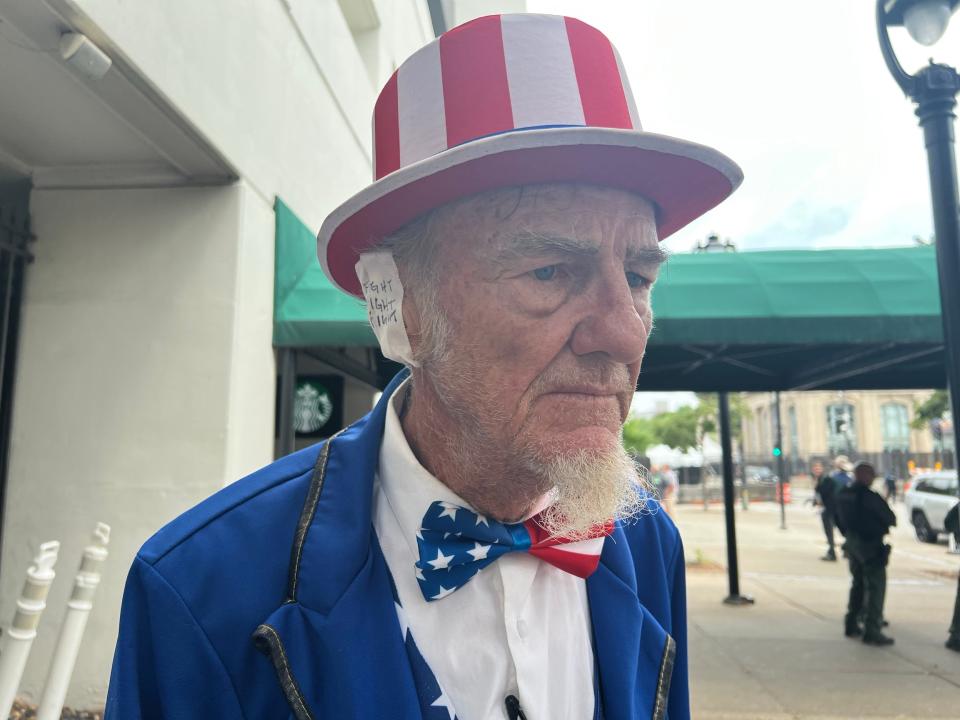 Duane Schwingel said he was dressed by the “spirit of Uncle Sam.” He said he wanted to start selling “fight fight fight” Band-Aids.