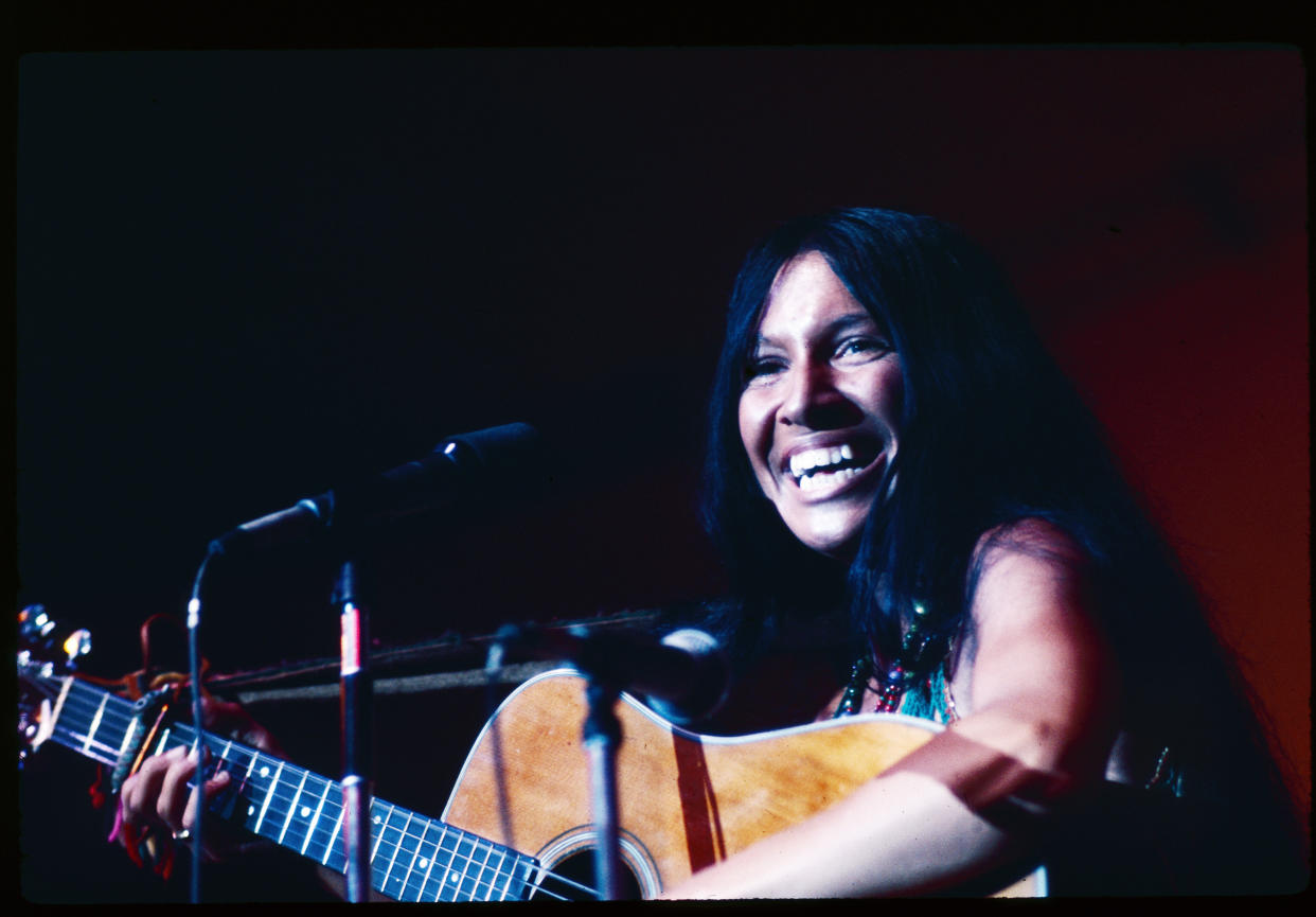 Canadian Folk and Pop musician Buffy Sainte-Marie plays guitar as she perfoms onstage, New York, New York, July 20, 1969. (Photo by Edmund Eckstein/Getty Images)